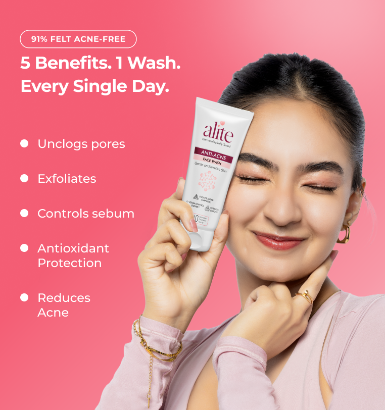 Woman holding a alite skincare product 